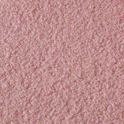 A close-up texture shot of a dusty pink loop pile fabric, showing the detailed curly fibers and soft sheen.