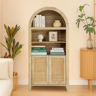 An arched wooden bookcase with a light natural wood finish and woven rattan doors, styled in a warm beige living room with books, a vase, and plants.