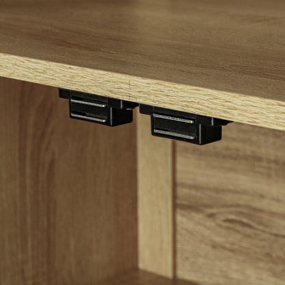 Close-up of two black doors glide sliders installed under a light oak wood desk inside a matching wood cabinet.