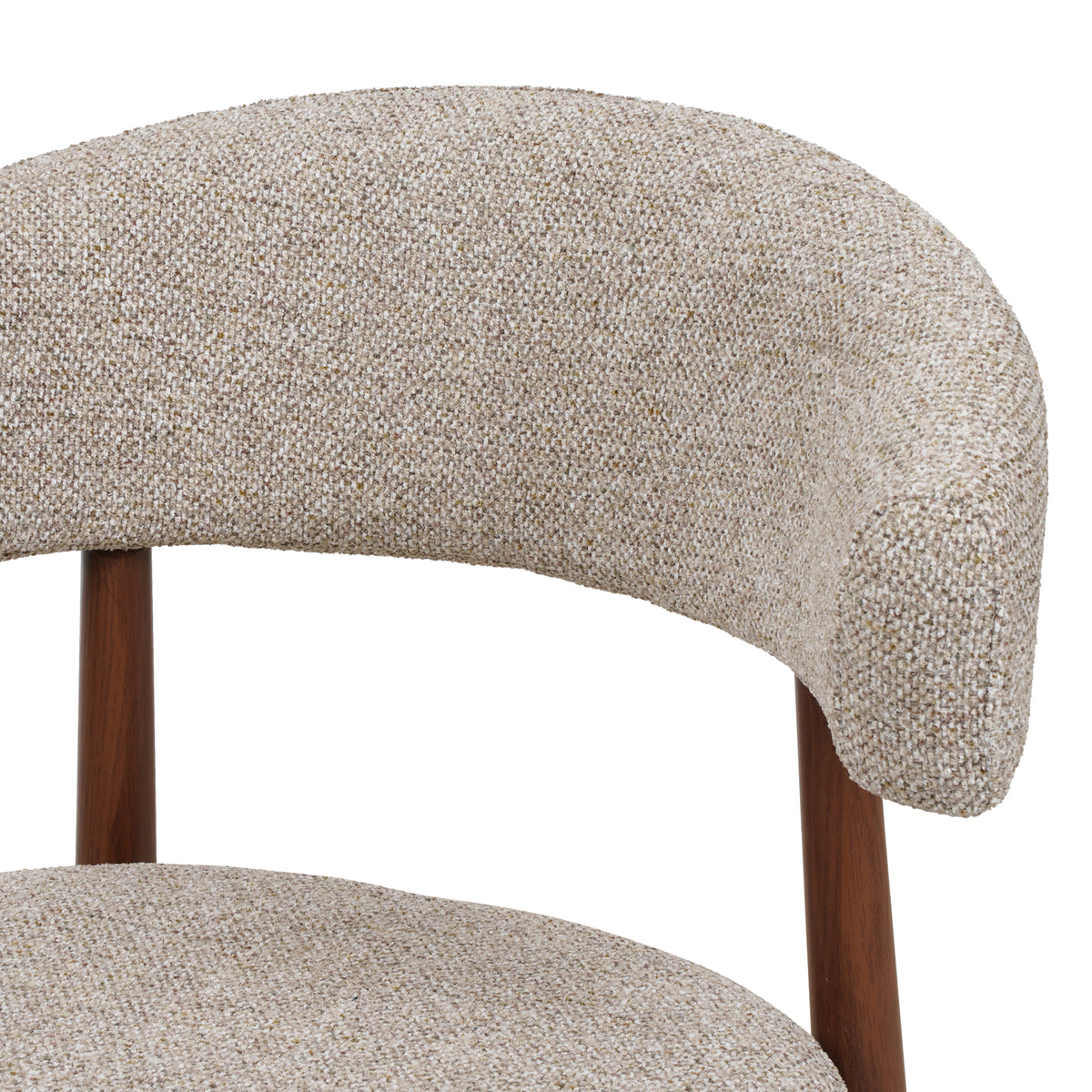 Close-up of a modern upholstered chair showing a curved backrest and seat in a textured beige tweed fabric, with dark brown wooden legs against a white background.