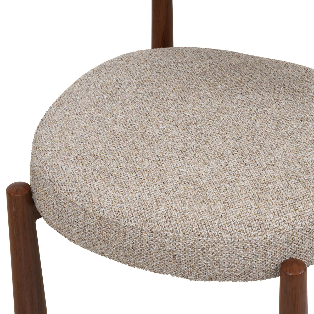 Close-up of a round upholstered chair seat in a textured beige and white woven fabric, with dark brown wooden legs visible against a white background.